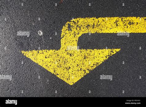 Yellow Arrow, Yellow Road Marking Stock Photo - Alamy