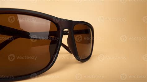 sun polarized safety glasses closeup on beige background 12721381 Stock Photo at Vecteezy