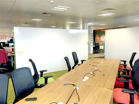 Freestanding whiteboard walls create a more informal meeting area, an open plan alternative to a ...