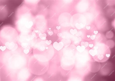 Premium Vector | Pink bokeh hearts valentine's day background