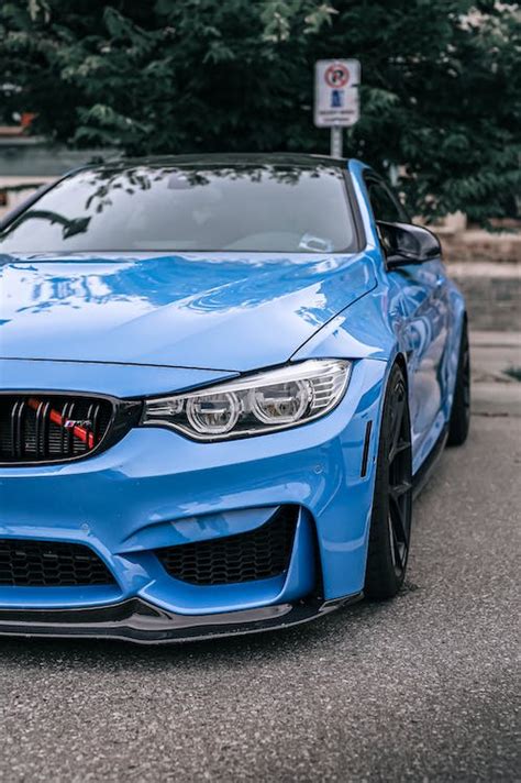 A Blue BMW M4 on the Parking Lot · Free Stock Photo