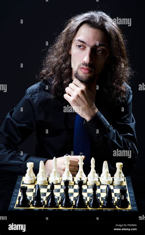 Chess player playing his game Stock Photo - Alamy