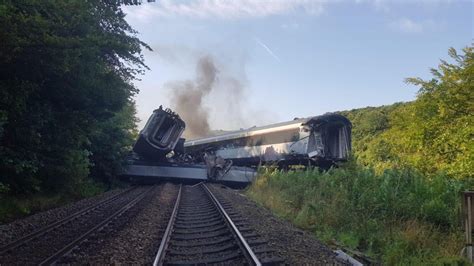 Shocking first pictures show ScotRail train carriages piled up and on fire after landslip crash ...