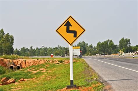 Double Curve Road Sign Signal And Bridge Stock Image - Image of fuel, line: 13065945