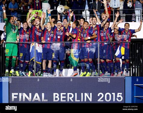 Barcelona players lift the UEFA Champions League Trophy on the Balcony ...