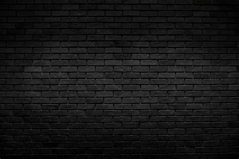 Download The old vintage black brick wall background with lighting ...