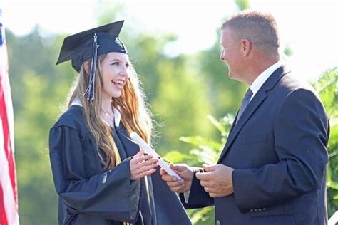 South Columbus High School graduation sends 182 graduates around the football stadium track ...