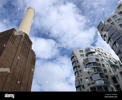 Battersea Power Station, London, UK. Old fashioned chimneys against ...