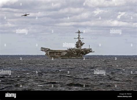 An F A-18F Super Hornet prepares to land on the aircraft carrier ...