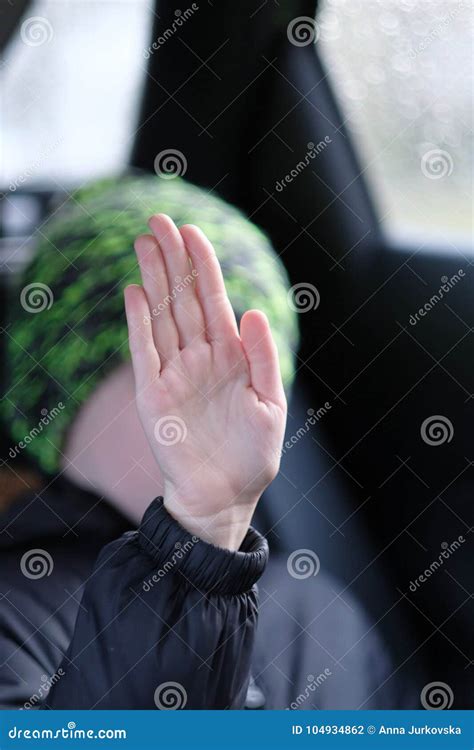 A Child Sitting in the Car and Raising His Hand. Stock Photo - Image of ...