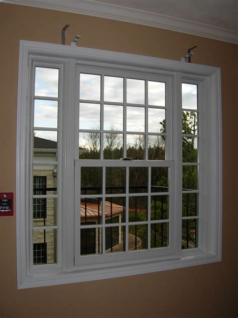 This is a double hung/picture combination window with colonial style grilles - custom made by ...