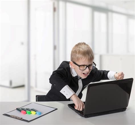 Premium Photo | Portrait of studying boy with laptop