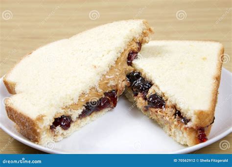 Peanutbutter and Jelly Sandwich Cut in Half Served on Plate Stock Photo ...