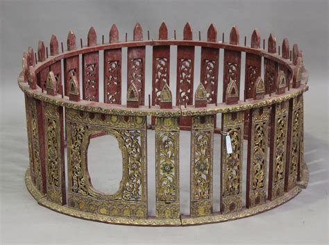 A 20th century Burmese Kyi-Waing gong frame, each section carved and ...