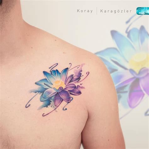 a man with a flower tattoo on his chest next to a blue and purple flower