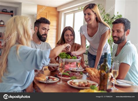 Group Friends Eating Lunch Together Having Great Time Home Stock Photo by ©Ivanko1980 217686254