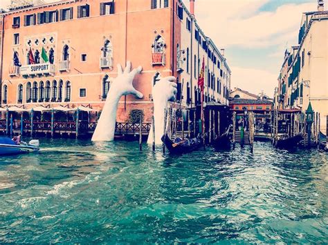 Contemporary Sculpture by Lorenzo Quinn Emerges from Venice's Lagoon