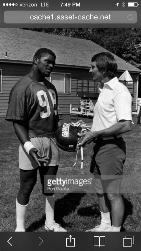 Head Coach Ray Perkins meeting the rookie linebacker Lawrence Taylor at Giants training camp in ...