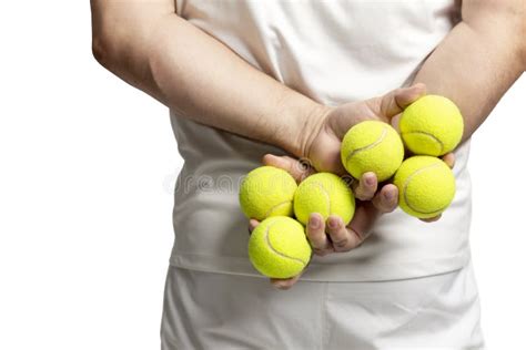 A Man Holds Tennis Balls in His Hands. Back View. Close-up. Isolated on a White Background Stock ...