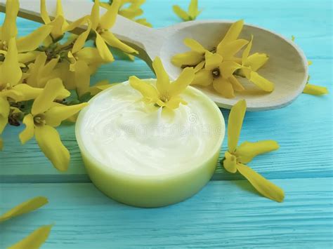 Cream Product Cosmetic Skin Extract Yellow Ointment Flowers on a Wooden ...