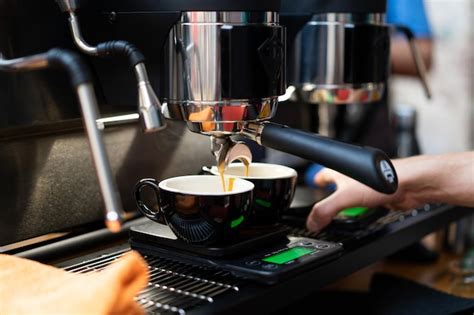 Premium Photo | A barista in a coffee machine makes coffee