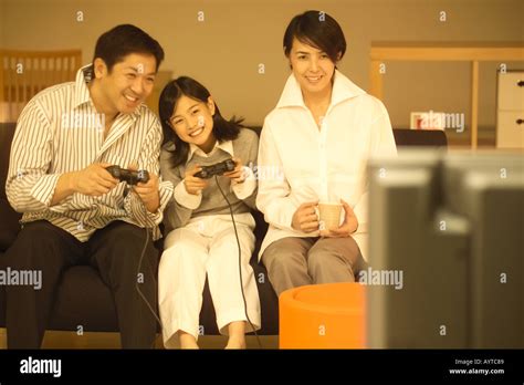 Family playing computer game Stock Photo - Alamy