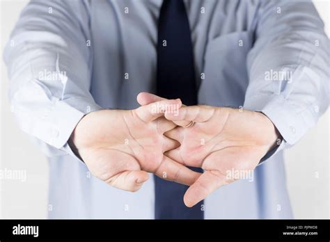 Man cracking the knuckles of his hands and fingers (knuckle-cracking or knuckle joints Stock ...