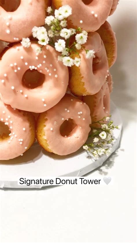 Signature Donut Tower 🤍 | Donut tower, Chocolate donuts, Strawberry donuts