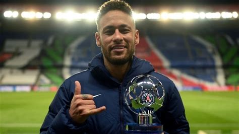 Neymar da Silva Santos Junior Is Standing In Blur Stadium Background With Trophy Wearing Blue ...