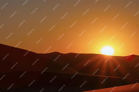 Premium Photo | Sunset over the sand dunes in the namib desert