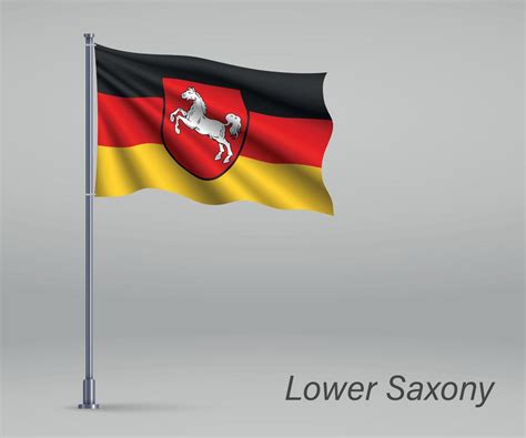 Waving flag of Lower Saxony - state of Germany on flagpole. Temp ...