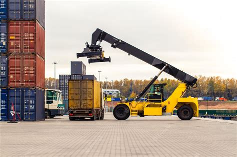 Premium Photo | Truck while loading in logistic shipping yard with ...