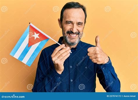 Middle Age Hispanic Man Holding Cuba Flag Smiling Happy and Positive ...