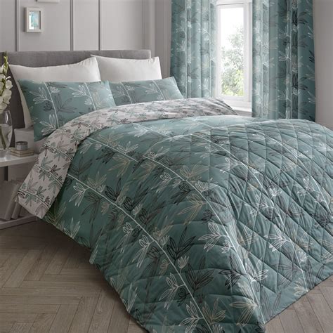 The big, bold leaf design on the Imogen teal cotton rich duvet set will ...