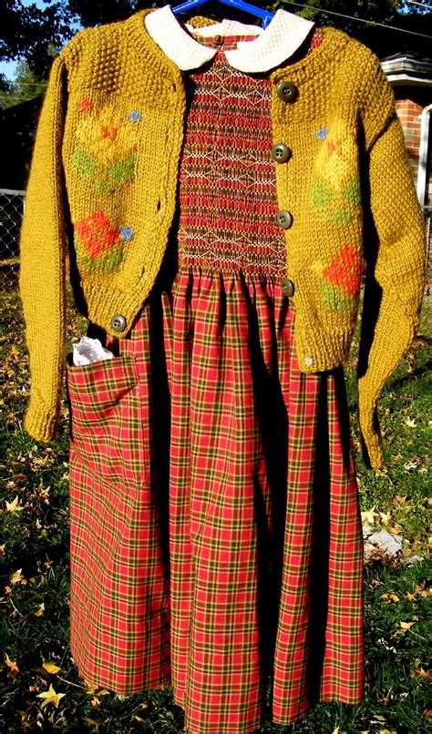 a dress and jacket are hanging on a clothes line