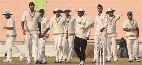 The Punjab players take a break in between overs | ESPNcricinfo.com