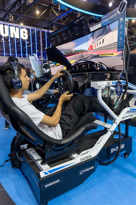 Boy Playing a Racing Game on a Racing Simulator · Free Stock Photo