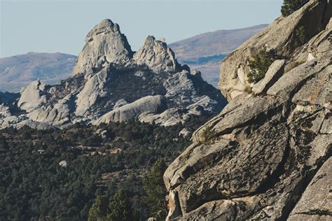 Gray Rocky Mountains Surrounded With Trees · Free Stock Photo