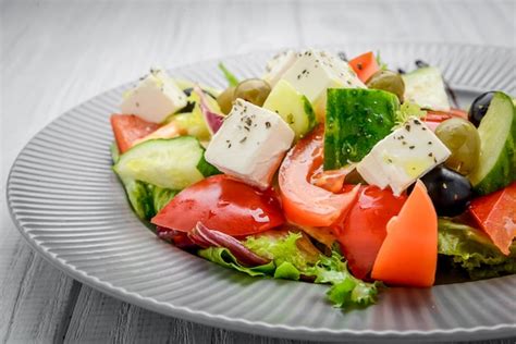 Premium Photo | Greek salad with vegetables and spices