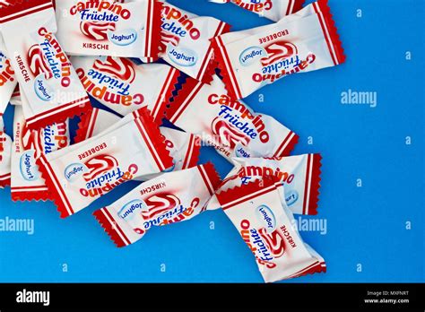 Campino boiled sweets, fruit and yogurt flavours, blue background Stock Photo - Alamy