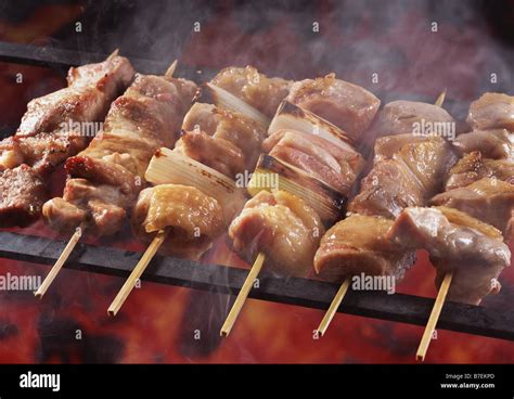 Grilled chicken on sticks Stock Photo - Alamy