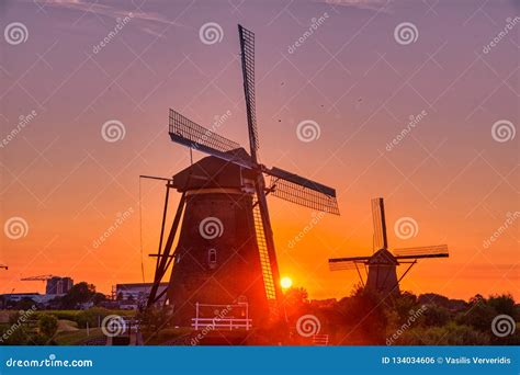 View of Traditional Windmills at Sunset in Kinderdijk, the Netherlands Stock Photo - Image of ...