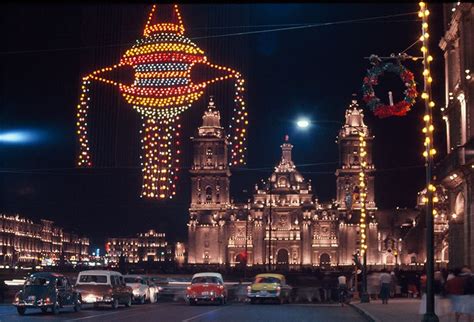 Holiday lights decorate the sky, cathedral and streets of the zocalo in ...