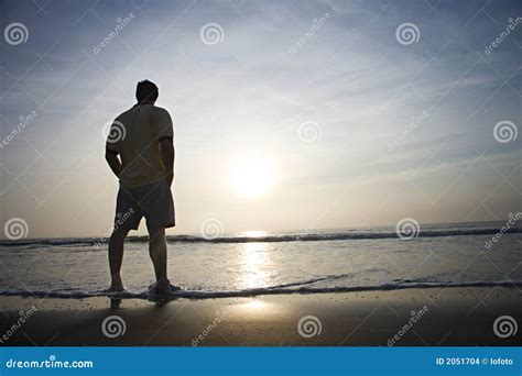 Man alone on beach. stock photo. Image of silhouette, travel - 2051704