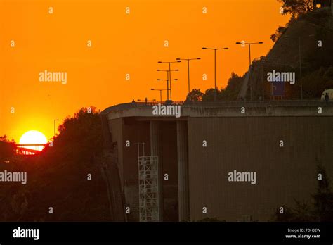 Highway at sunset Stock Photo - Alamy