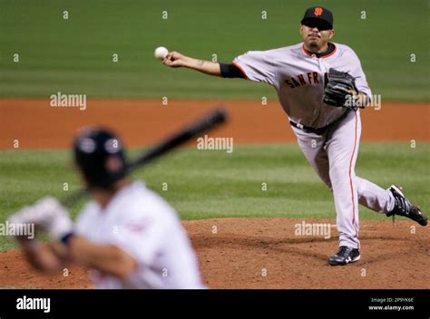 San Francisco Giants' Sergio Romo pitches to Cleveland Indians' David Dellucci in the eighth ...