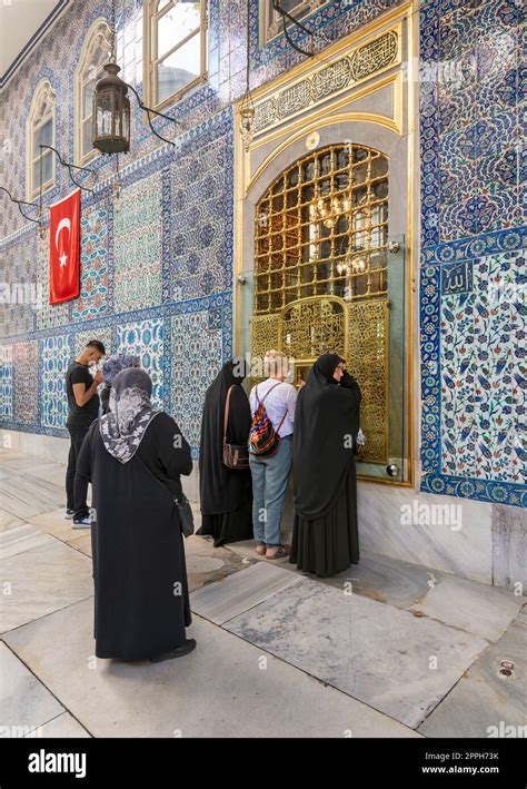 People praying in front of the tomb of Abu Ayyub al-Ansari at Eyup Sultan Mosque, Istanbul ...