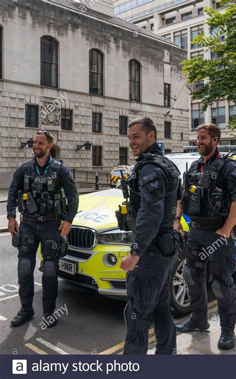 City of London armed police officers take a break and stand in ...