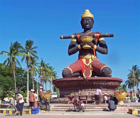 The entrance to Battambang, Cambodia is dominated by a huge, black painted, statue of King Ta ...