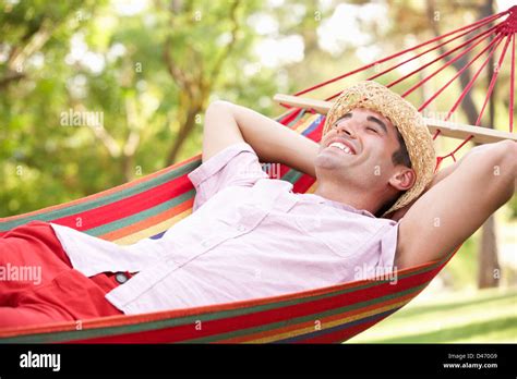 Man Relaxing In Hammock Stock Photo - Alamy